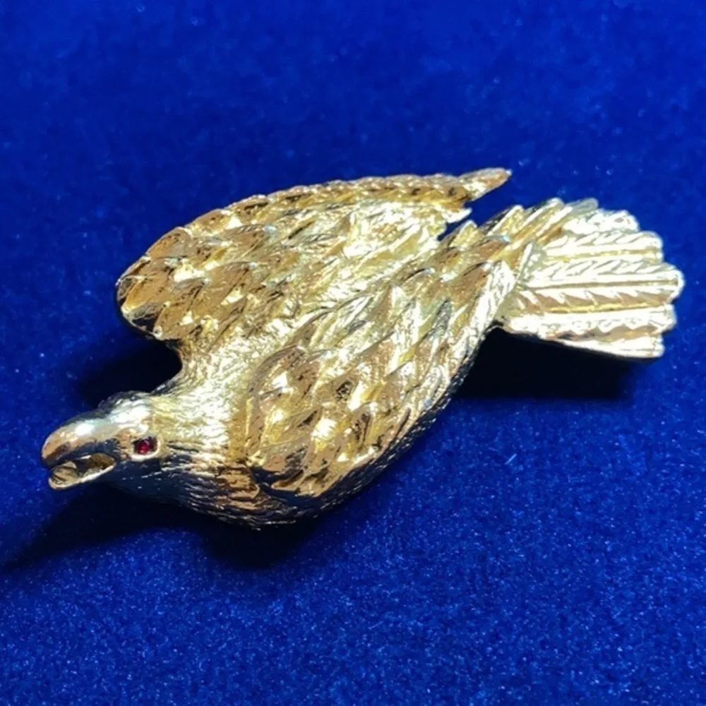 Vintage ‘60s gold tone Nesting eagle with red rhinestones